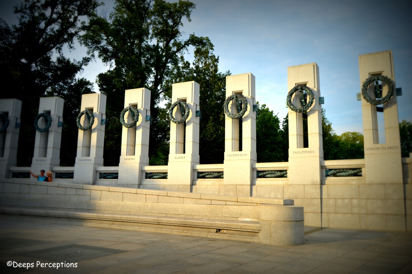 There are 56 granite pillars like these with bronze panels surrounding the memorial with two archways on either side. 